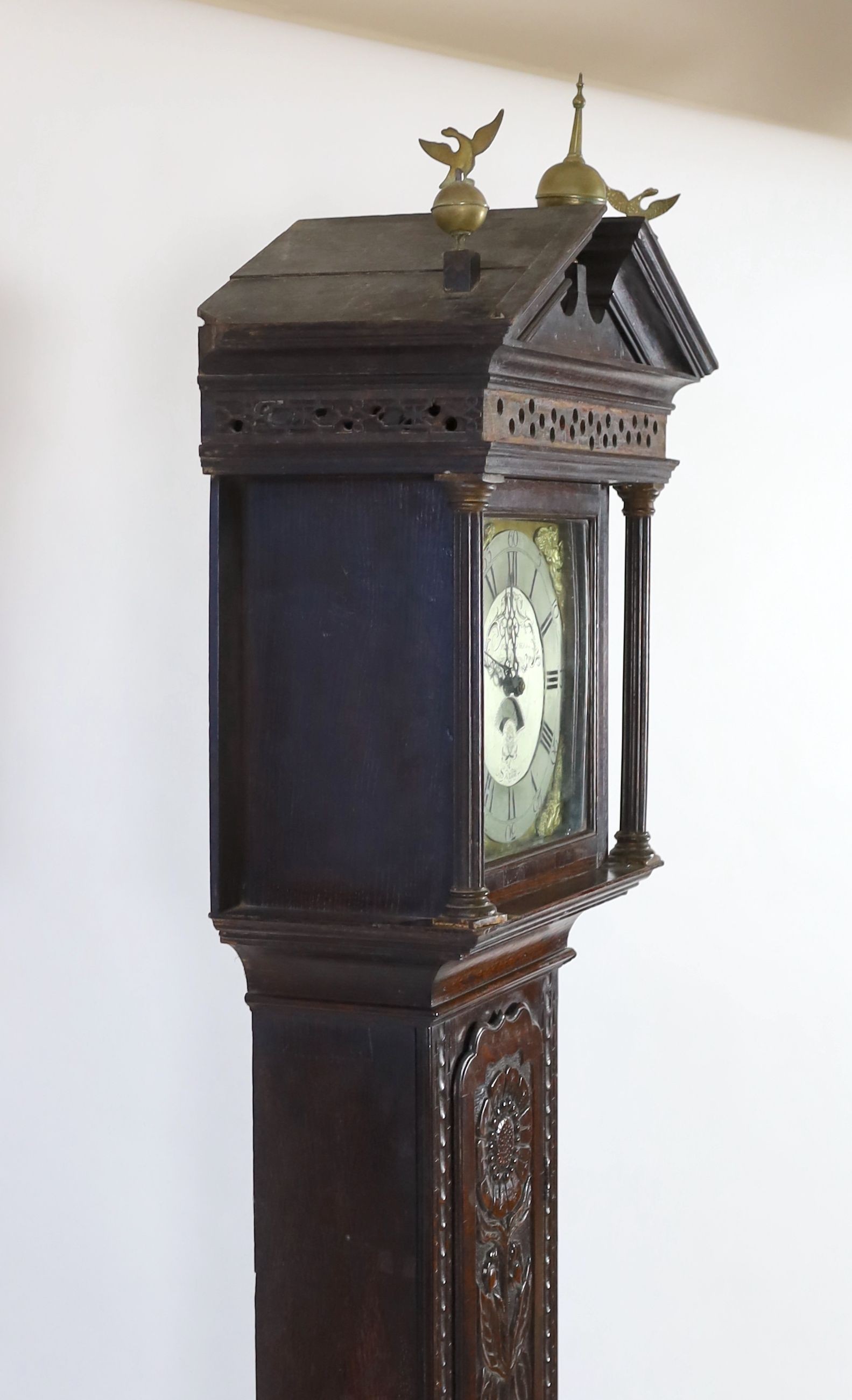 A George III oak cased thirty hour longcase clock, by Price Evans, Salop, the 28cm dial with calendar aperture, case later carved, height 230cm